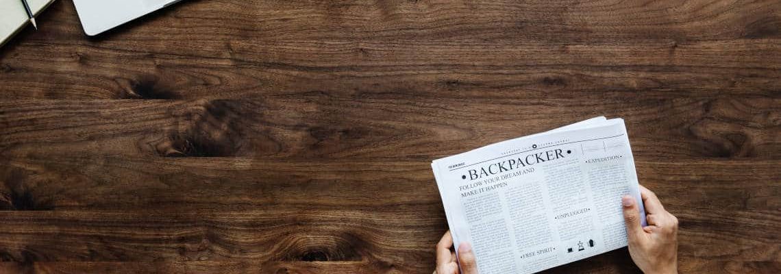 Newspaper over wooden table